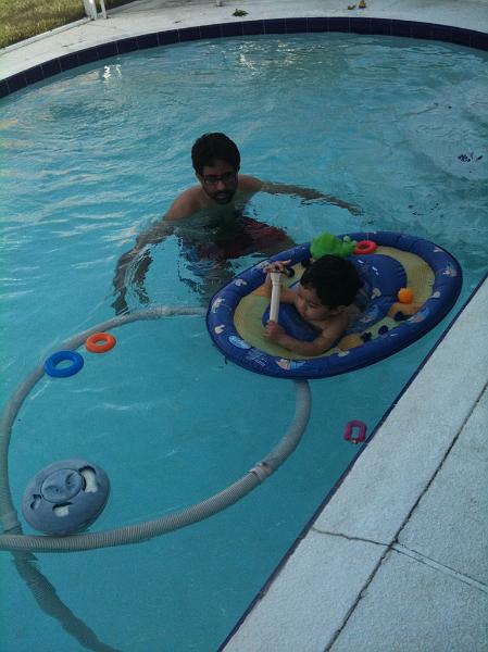 IMG_0017.JPG - In the pool playing with his favourite toy - the pool thermometer