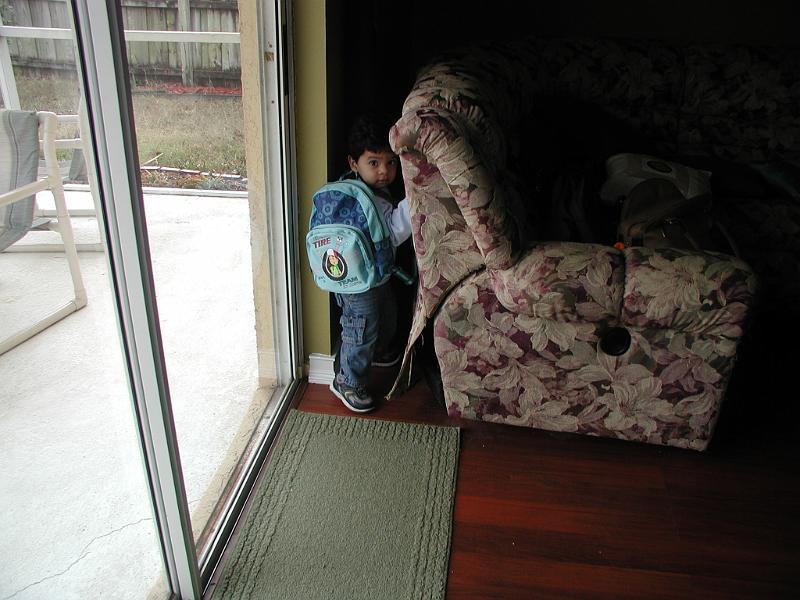 P1180105.JPG - Trying to hide behind the sofa