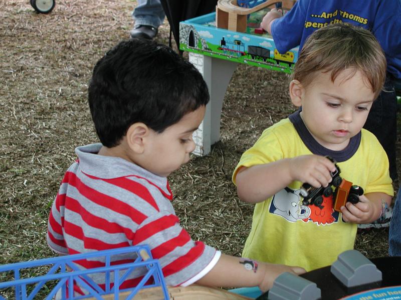 P4180151.JPG - Jacob and Rohan are back at the train table. They were getting too messy with the sand.
