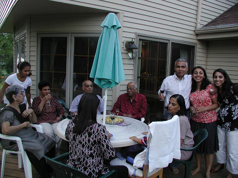 P7040002.JPG - In July 2009 we had an another Halarnkar family reunion at Neeenah, Wisconsin. In all we were twelve. In decreasing order of age - Padmakar, Shaila, Ramakanth, Aru, Premjit, Sujatha, Rajesh Devika, Kavitha, Aditee, Natasha and Rohan. Here we are out side on the deck at the Shet's Wisconsin residence.