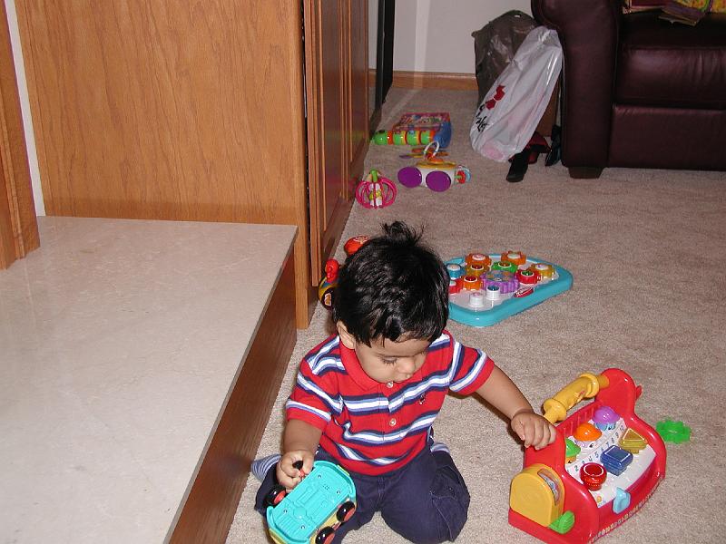 P7040020.JPG - He made full use of the 50 pounds of toys. His bag of toys was opened and searched by airport security both ways - to Neenah and back.