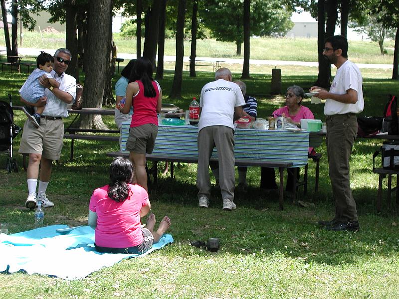 P7050038.JPG - Happy picnikers wolfing down the food.