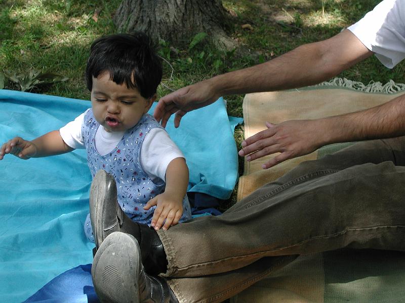 P7050046.JPG - Rohan is not impressed with his Dad's dirty boots and wants to clean them