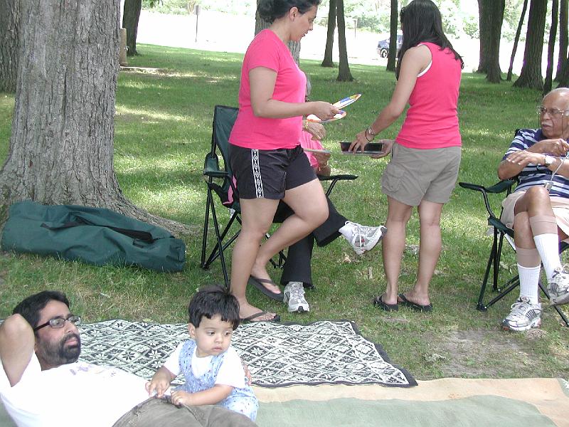 P7050051.JPG - Food going around again. Rohan is worried that he may not get any.