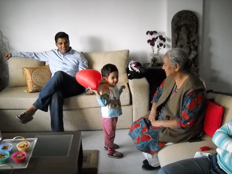 DSCN0065.JPG - Anay waving a red pillow