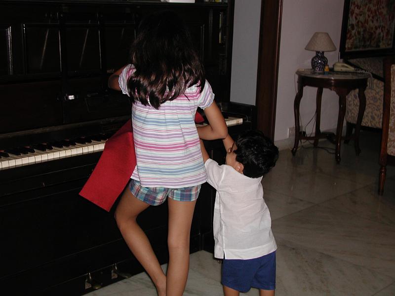 P9180023.JPG - Tara and Rohan at the piano. Only Tara can really play it.