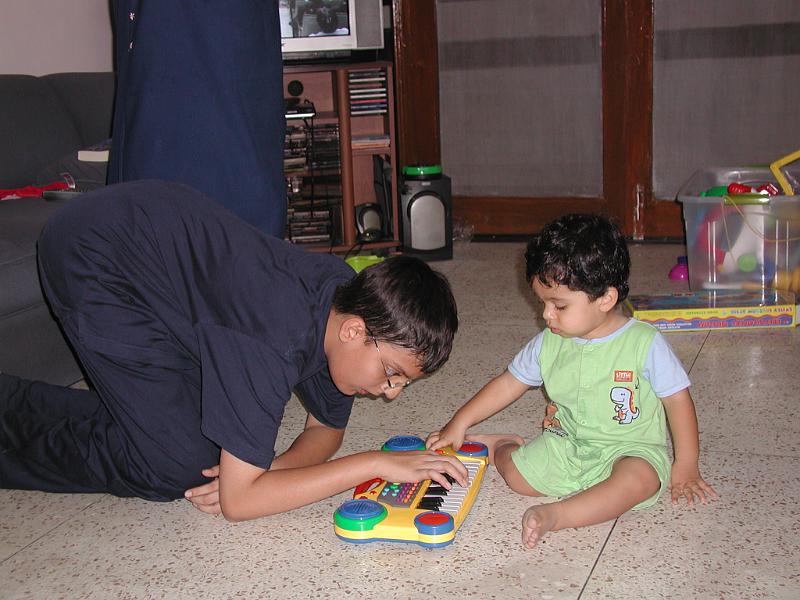 P9300065.JPG - Karan playing with Rohan's toys