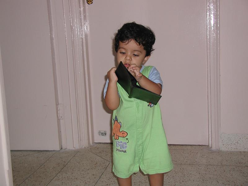 P9300066.JPG - Rohan playing with Karan's wallet