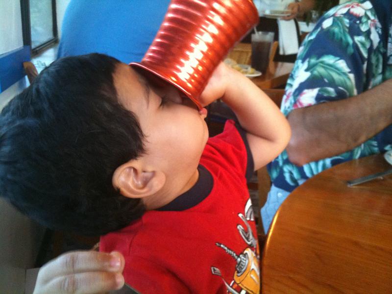 IMG_0200.JPG - On May 10 Fotis and Sophia came down to visit us. One of the days we went down to Tarpon Springs for dinner. Here he is draining the contents of a carafe.