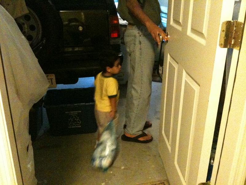 IMG_0215.JPG - Rohan helps around the house. Here he is taking his used diapers to the trash can