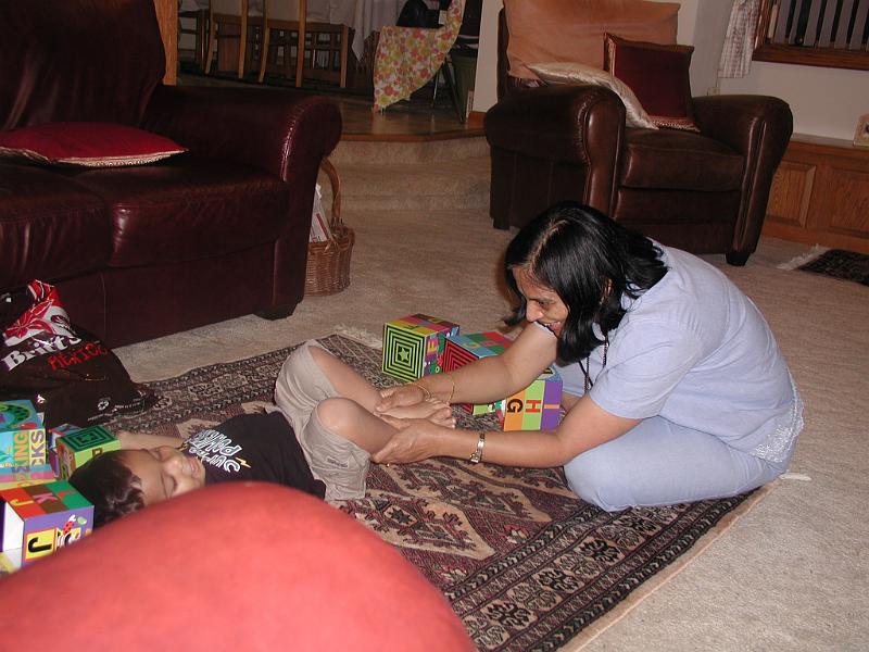 P7040018.JPG - Rohan being played with by his grand aunt