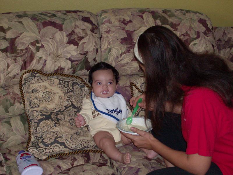 HPIM0987.JPG - Eating solid food. The solid food helps him sleep thru the night. He sleeps anywhere from 10 to 12 hours in the night.