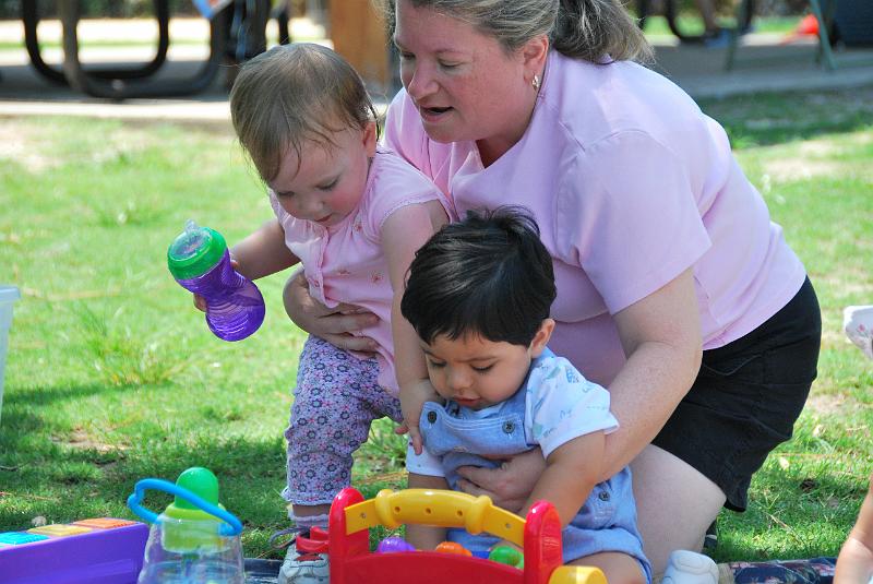 DSC_0674.JPG - Stephanie trying to lift Hannah and Rohan