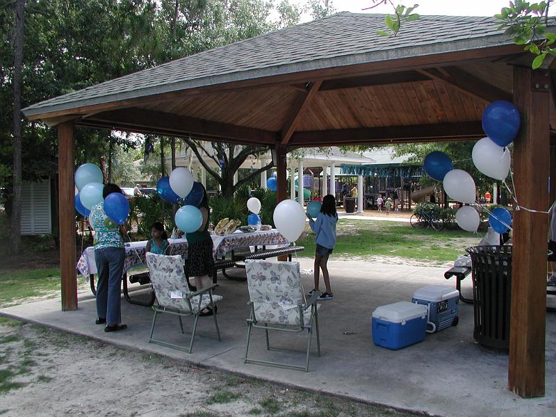 P5250015.JPG - Here you see the backsides of Gitu, Aditi and Tara. Only Nandi had the good sense to face the camera. In the background you see the childrens play area that is part of the park
