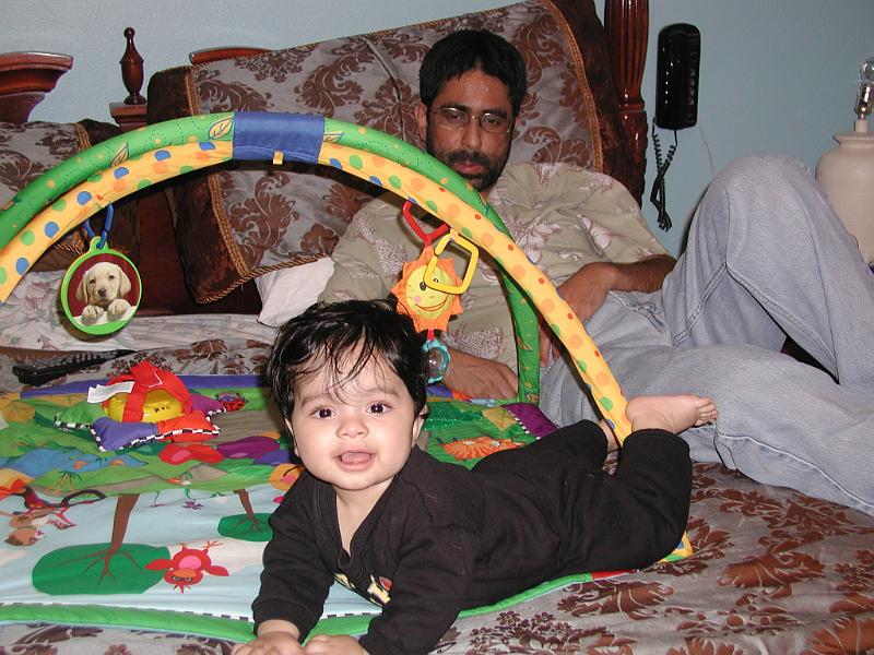 PC080052.JPG - Playing on our bed.