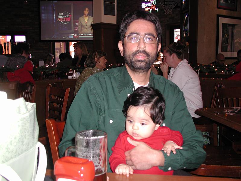 PC220060.JPG - Rohan with his father. He is eyeing the beer