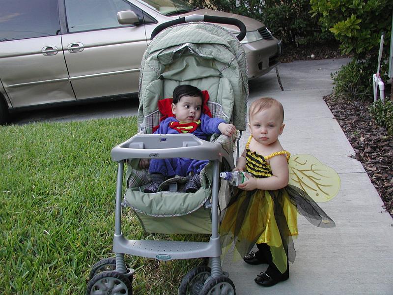 PA310001.JPG - Halloween was Oct 30, 2008. Rohan went as SuperMan. Hannah is a bumble bee. Here they are dressed and waiting for trick or treat. Thanks to the extended daylight saving time it did not get dark till 7:30pm so they had a bit of a wait