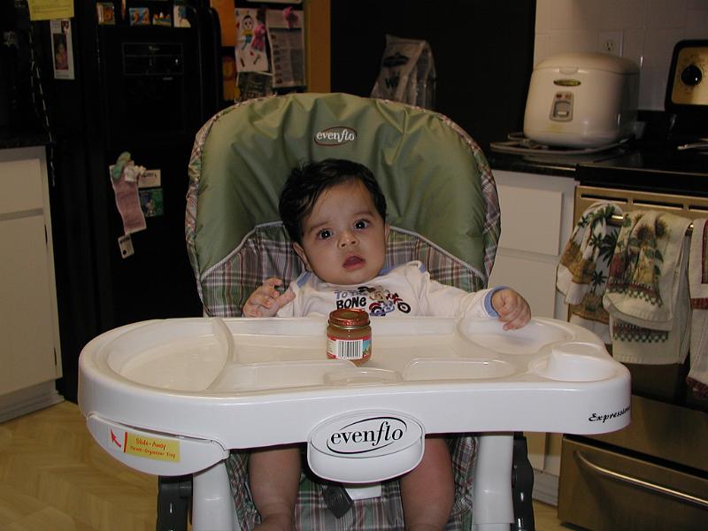 PB130057.JPG - In his high chair in the kitchen