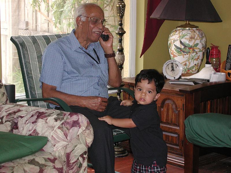 P9020198.JPG - Rohan with Grand father speaking on the phone.